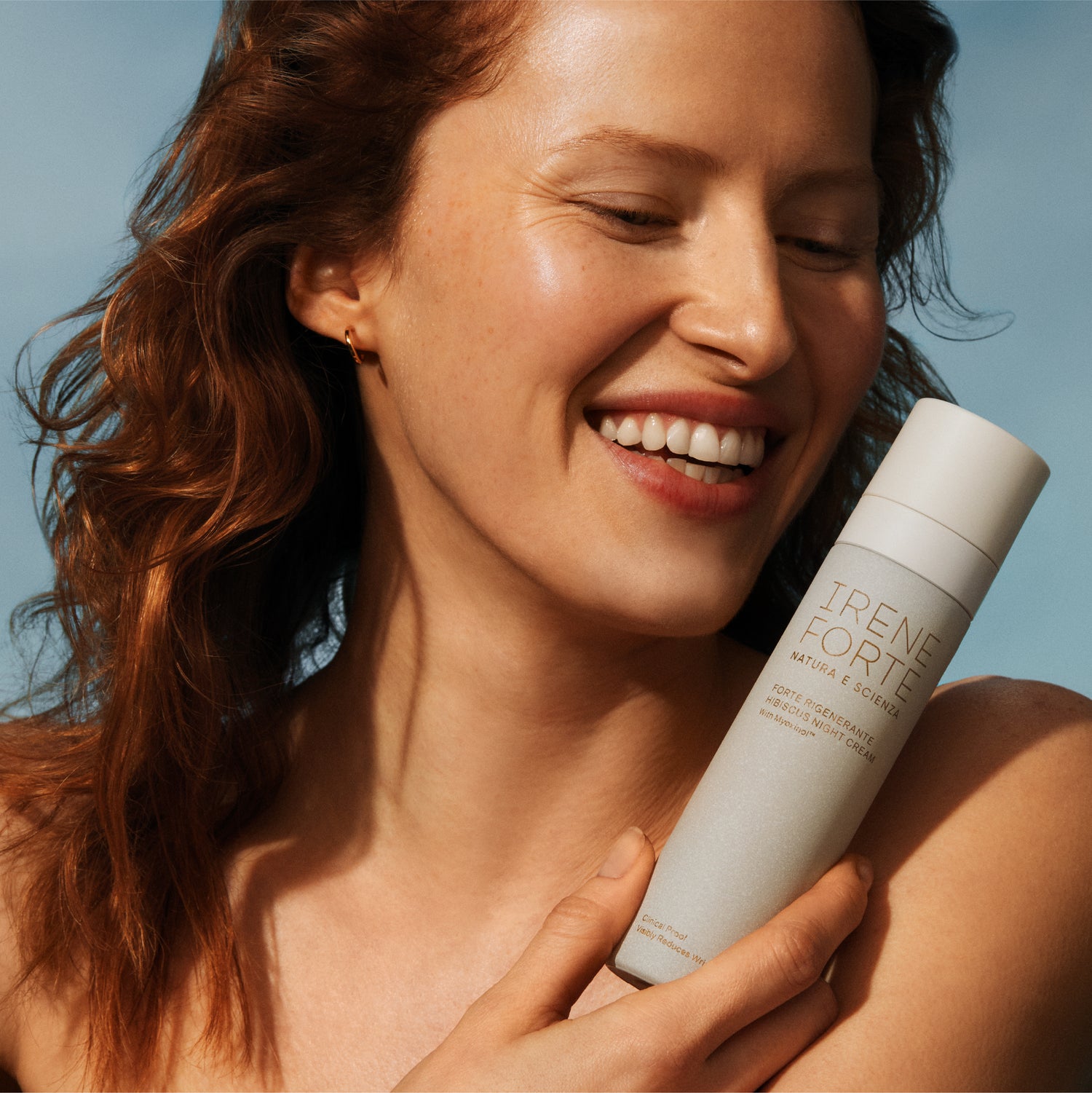 Woman holding a bottle of &